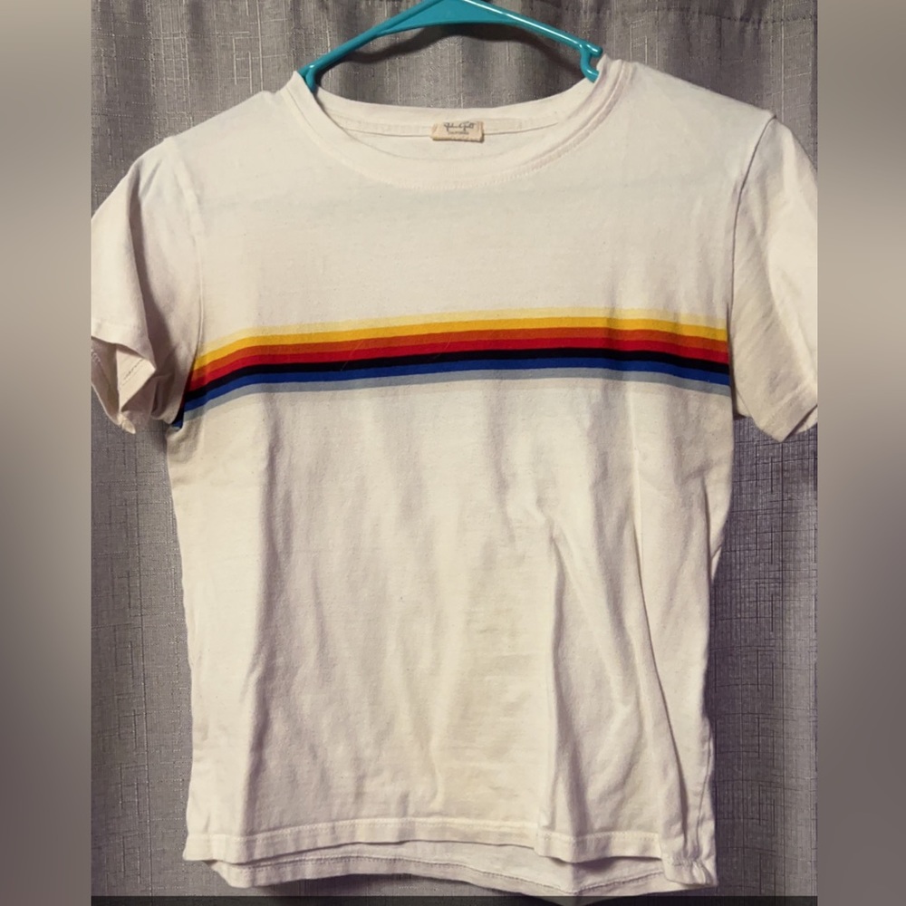 white shirt sleeve shirt with rainbow stripe across chest